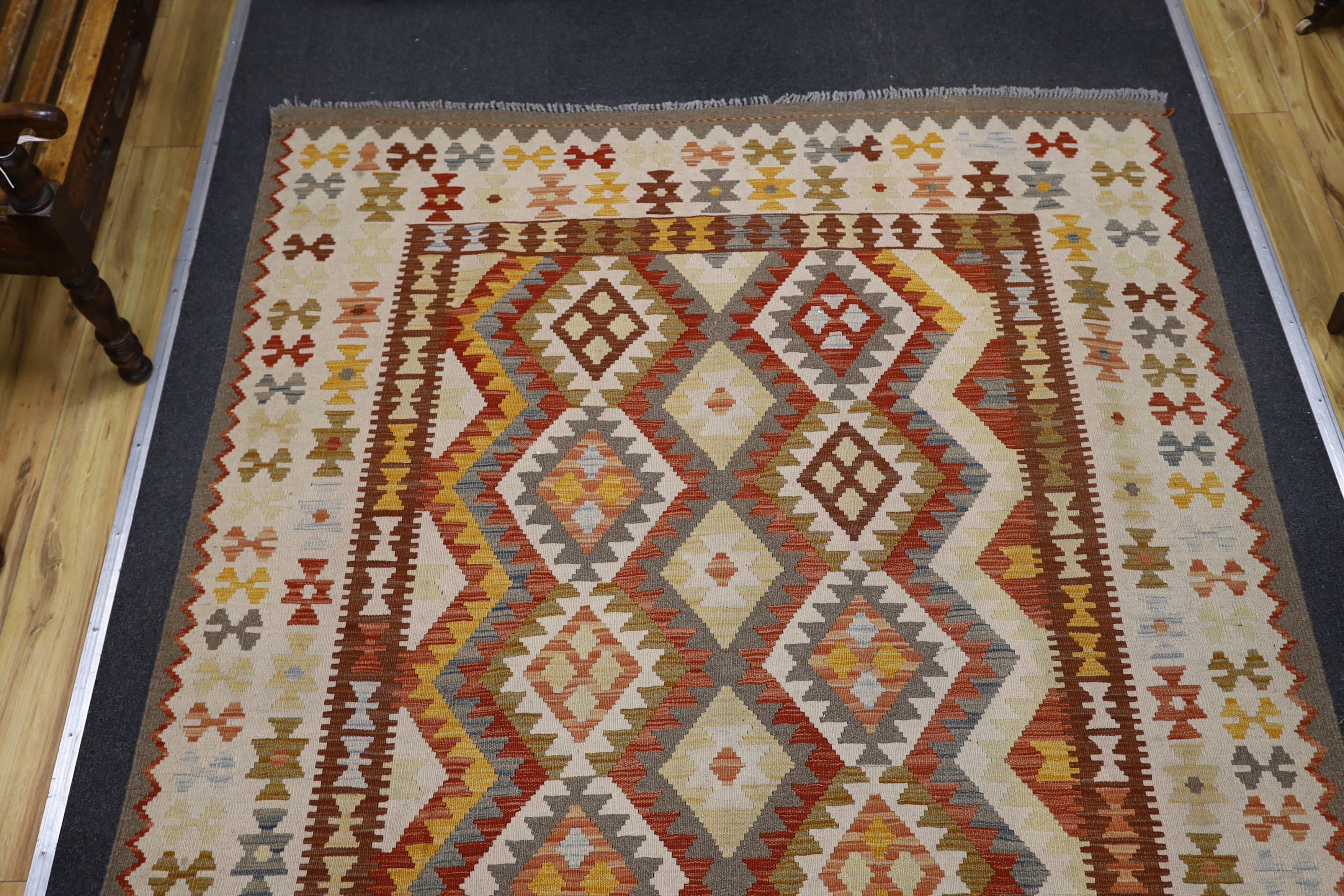 A Kilim polychrome geometric carpet, 250 x 177cm